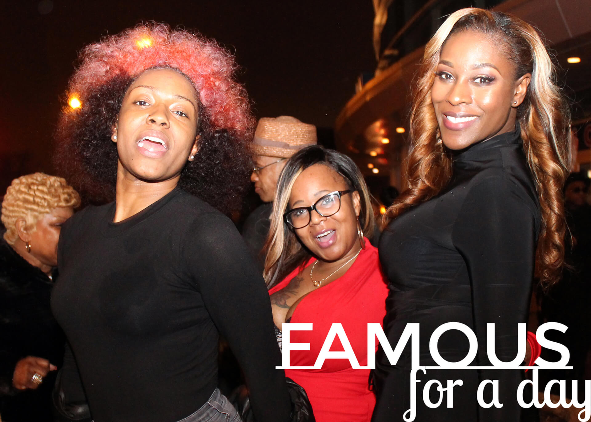 Guests smiling and posing together while being photographed at a celebrity-style event